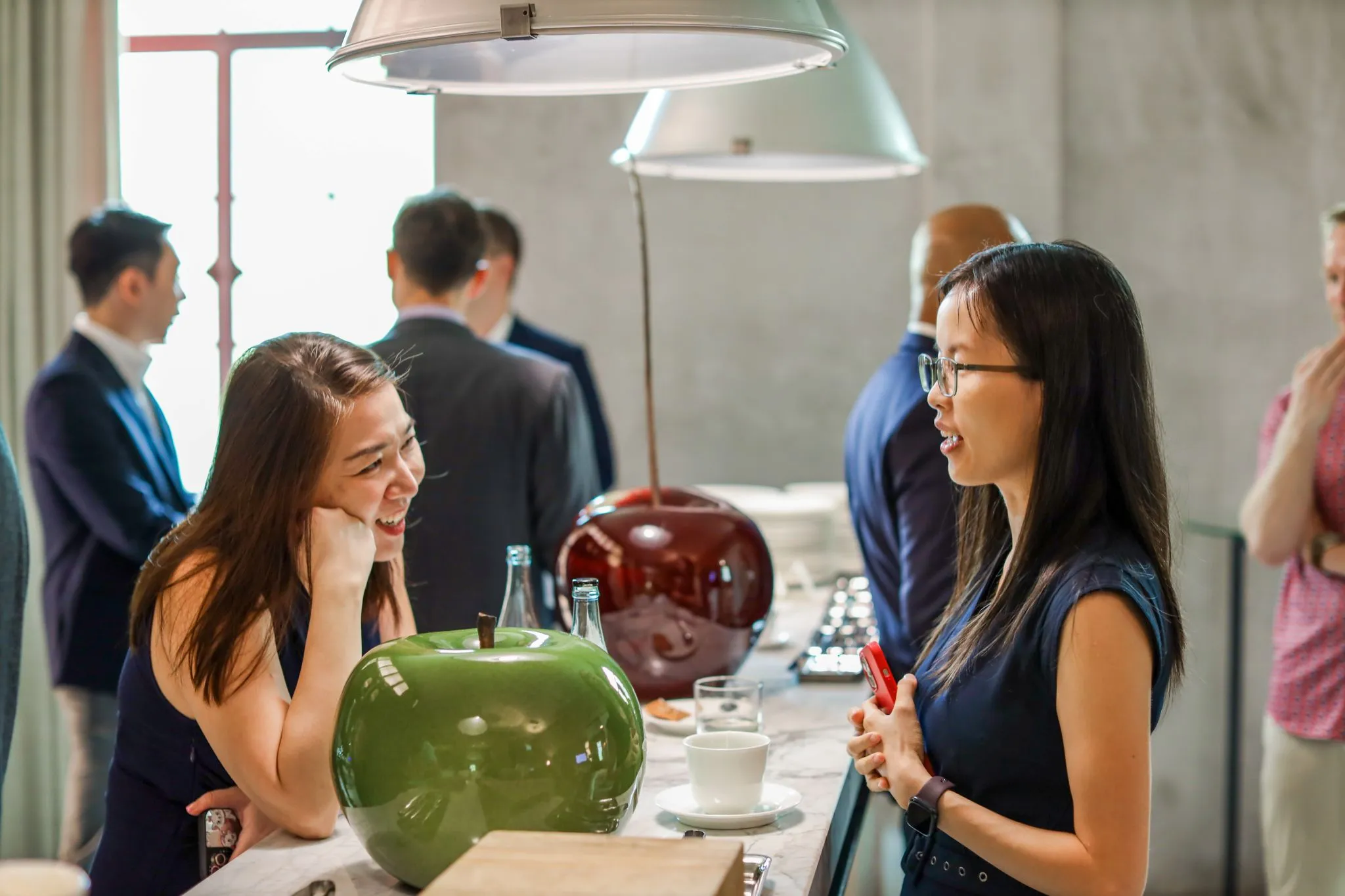 cover image of event - people dining in a corporate setting